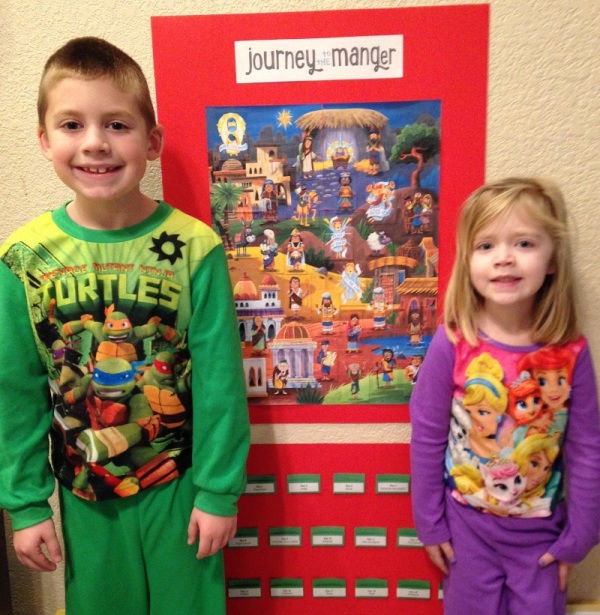 On Christmas morning, Jackson and Lauren stand by our Journey to the Manger calendar, complete with Jesus!